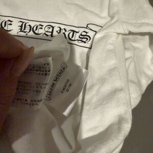 White long sleeve baby chrome heats tee. 6m runs big